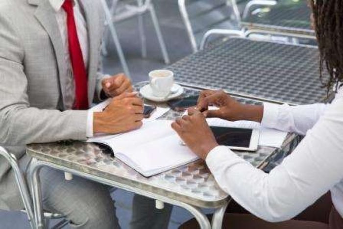 business-partners-discussing-agreement-coffee-shop small